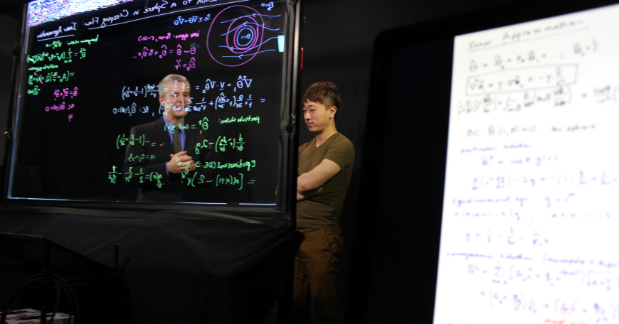 MIT Professor Martin Bazant (left) and Joey Gu, lecturer and digital learning scientist, discuss lecture content for filming at MIT’s Lightboard studio.