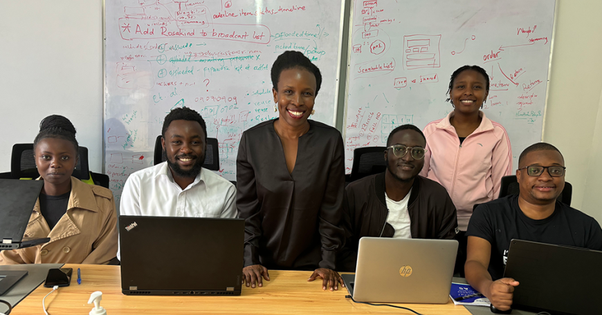 June Odongo (left) and Cynthia Wacheke, both standing, with members of the software team at Senga Technologies